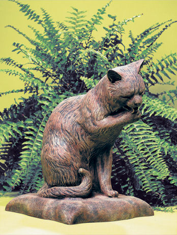 cat statue with waving paw