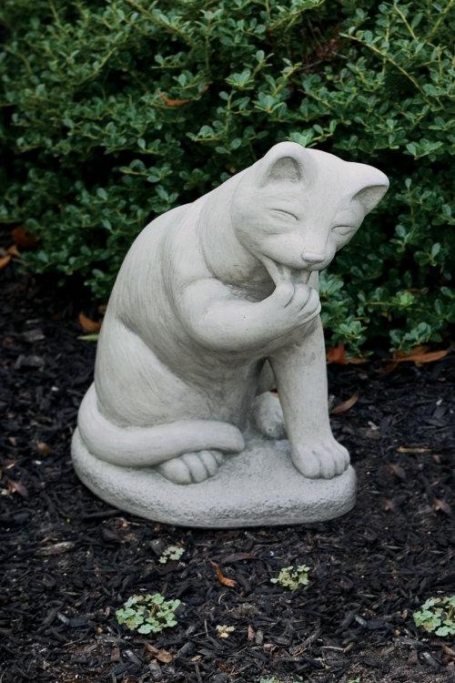 cat statue with waving paw